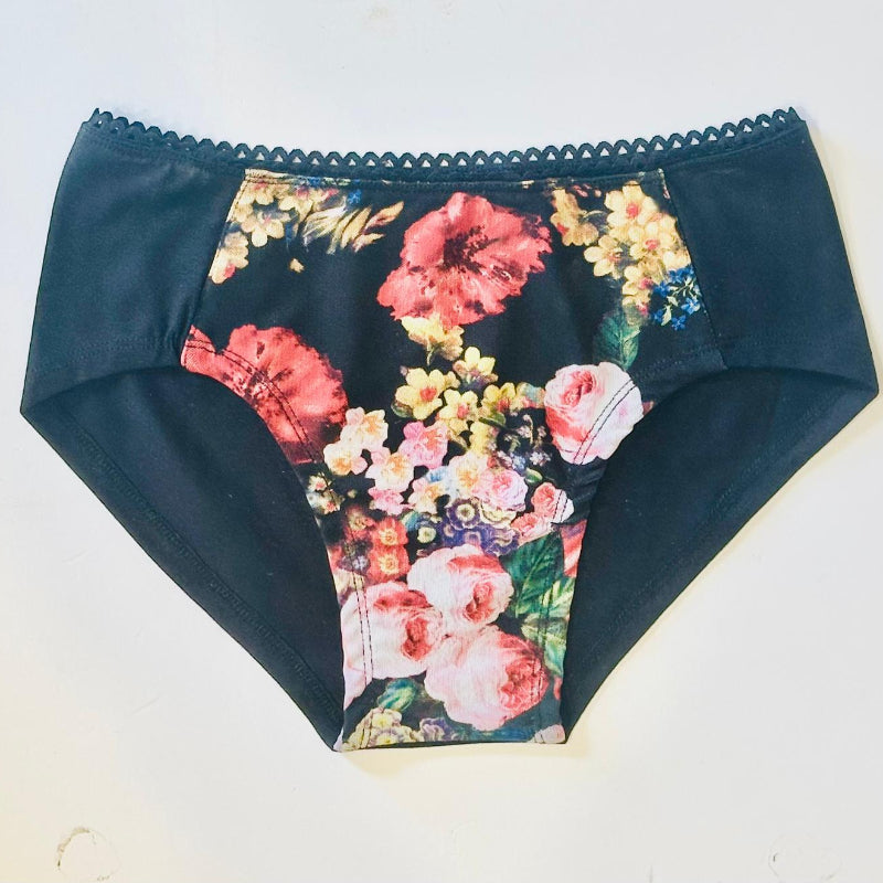 women's underwear with a floral pattern on the front and a solid black color on the sides, featuring lace detailing.